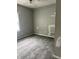 Bedroom features soft gray carpet, painted walls, and a window at 2244 Lafayette St, Anderson, IN 46012