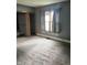 Spacious bedroom with neutral walls and carpet, offering a comfortable living space at 2244 Lafayette St, Anderson, IN 46012