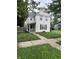 Traditional two-story home featuring a quaint front porch and well-maintained lawn at 2244 Lafayette St, Anderson, IN 46012