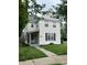 Traditional two-story home featuring a quaint front porch and well-maintained lawn at 2244 Lafayette St, Anderson, IN 46012