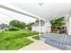 The covered patio looks out onto the backyard and detached garage at 2413 Fowler St, Anderson, IN 46012