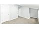 Spacious bedroom with gray walls, plush carpet, and ample closet space at 2413 Fowler St, Anderson, IN 46012
