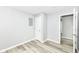Neutral bedroom featuring a standard closet door, fresh paint, and new vinyl plank flooring at 2413 Fowler St, Anderson, IN 46012