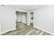 Open-concept living room featuring stylish gray walls and new vinyl plank flooring at 2413 Fowler St, Anderson, IN 46012