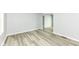 Inviting living room with wood-look flooring and neutral paint, offering a bright and airy atmosphere at 2413 Fowler St, Anderson, IN 46012