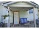 Cozy back porch featuring a comfortable bench and ambient string lights at 2616 Jackson St, Anderson, IN 46016