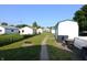 Expansive backyard with multiple storage sheds, a fire pit, and ample space for outdoor activities at 2616 Jackson St, Anderson, IN 46016