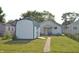 The backyard features a convenient storage shed, lush greenery, and a peaceful setting at 2616 Jackson St, Anderson, IN 46016