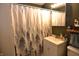 Cozy bathroom featuring a vanity with sink, mirrored cabinet, and stylish shower curtain at 2616 Jackson St, Anderson, IN 46016