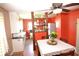 Cozy dining area with a ceiling fan and decorative shelving at 2616 Jackson St, Anderson, IN 46016