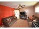 Inviting living room with plush sofas, a ceiling fan, and an entertainment center at 2616 Jackson St, Anderson, IN 46016