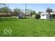 A spacious backyard featuring a well-maintained lawn, and sheds at 311 Fall Creek Dr, Anderson, IN 46013