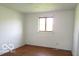 Bright bedroom boasts hardwood floors and a window that floods the space with natural light at 311 Fall Creek Dr, Anderson, IN 46013