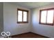 Bright bedroom features hardwood floors, two windows that flood the space with natural light at 311 Fall Creek Dr, Anderson, IN 46013