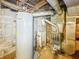 Unfinished basement area with hot water tank and furnace at 3251 Mars Hill St, Indianapolis, IN 46221