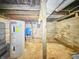 Unfinished basement area with hot water tank, and various utilities visible at 3251 Mars Hill St, Indianapolis, IN 46221