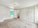Bedroom with neutral carpet and walls, multiple doors to other rooms at 3251 Mars Hill St, Indianapolis, IN 46221