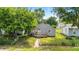 Charming gray home with a cozy front porch and a well-maintained lawn at 3251 Mars Hill St, Indianapolis, IN 46221