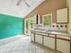 Open kitchen featuring ample cabinet space, double sink, and updated flooring, opening to the outdoors at 3251 Mars Hill St, Indianapolis, IN 46221