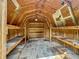 The inside of the backyard shed complete with shelves and wooden beams at 3251 Mars Hill St, Indianapolis, IN 46221