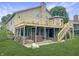 Large wooden deck overlooking the backyard with a hot tub and ample space for entertaining at 3287 Buckmoor Pkwy, Greenwood, IN 46143