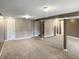 Spacious finished basement with carpet and support beams at 3287 Buckmoor Pkwy, Greenwood, IN 46143