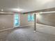 Finished basement featuring an exterior access door and a window at 3287 Buckmoor Pkwy, Greenwood, IN 46143