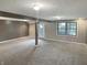Spacious finished basement with neutral carpet and recessed lights at 3287 Buckmoor Pkwy, Greenwood, IN 46143