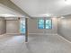 Finished basement with neutral carpet and an exterior access door at 3287 Buckmoor Pkwy, Greenwood, IN 46143