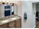 Bathroom with a granite-topped double sink vanity, white cabinets, and a matching framed mirror at 3287 Buckmoor Pkwy, Greenwood, IN 46143