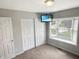 Bedroom with a television, closet and a large bay window, providing natural light at 3287 Buckmoor Pkwy, Greenwood, IN 46143