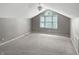 Bonus room features a large window and neutral carpet at 3287 Buckmoor Pkwy, Greenwood, IN 46143
