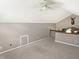 Open loft area boasts vaulted ceilings, a ceiling fan and neutral carpet at 3287 Buckmoor Pkwy, Greenwood, IN 46143