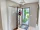 Entryway showcasing hardwood floors, a closet, and a view of the outdoor garden at 3287 Buckmoor Pkwy, Greenwood, IN 46143