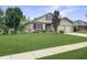 Inviting two-story home with a lush green lawn and mature trees in a well-kept neighborhood at 3287 Buckmoor Pkwy, Greenwood, IN 46143