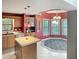 This open kitchen features stainless steel appliances, light countertops, wooden cabinets, and a breakfast nook at 3287 Buckmoor Pkwy, Greenwood, IN 46143