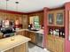 This kitchen features stainless steel appliances, light countertops, and wooden cabinets at 3287 Buckmoor Pkwy, Greenwood, IN 46143