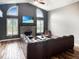 Bright living room featuring vaulted ceilings, a brick fireplace, and hardwood floors at 3287 Buckmoor Pkwy, Greenwood, IN 46143