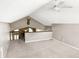Open loft area boasts vaulted ceilings and a ceiling fan at 3287 Buckmoor Pkwy, Greenwood, IN 46143