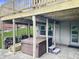 Outdoor patio under the deck with a covered spa and ample space for storage, offering versatile outdoor space at 3287 Buckmoor Pkwy, Greenwood, IN 46143