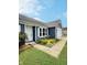 Charming blue home with a well-manicured lawn and colorful flower bed at 3341 Orchard Valley Dr, Columbus, IN 47203