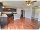 Open-concept kitchen features stainless appliances, island and hardwood floors at 3341 Orchard Valley Dr, Columbus, IN 47203