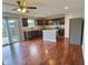 Eat-in kitchen with stainless refrigerator and island features hardwood floors at 3341 Orchard Valley Dr, Columbus, IN 47203