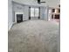Spacious living room features a fireplace, neutral carpet, and ample natural light at 3341 Orchard Valley Dr, Columbus, IN 47203