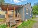 Back porch offers an outdoor space with wood deck and stairs perfect for relaxation at 3422 Hillside Ave, Indianapolis, IN 46218