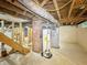 Unfinished basement with exposed utilities and brick chimney at 3422 Hillside Ave, Indianapolis, IN 46218