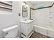 Bright bathroom showcasing a vanity with tub-shower combination at 3422 Hillside Ave, Indianapolis, IN 46218