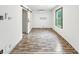 Minimalist bedroom design with hardwood flooring, natural light, and mini-split air conditioning at 3422 Hillside Ave, Indianapolis, IN 46218