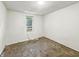Bedroom with carpeted floor and a window with window-mounted AC unit at 3422 Hillside Ave, Indianapolis, IN 46218