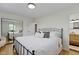 Cozy bedroom boasts ample natural light and a mirrored closet, enhancing the room's sense of space at 3841 Meridee Dr, Indianapolis, IN 46237